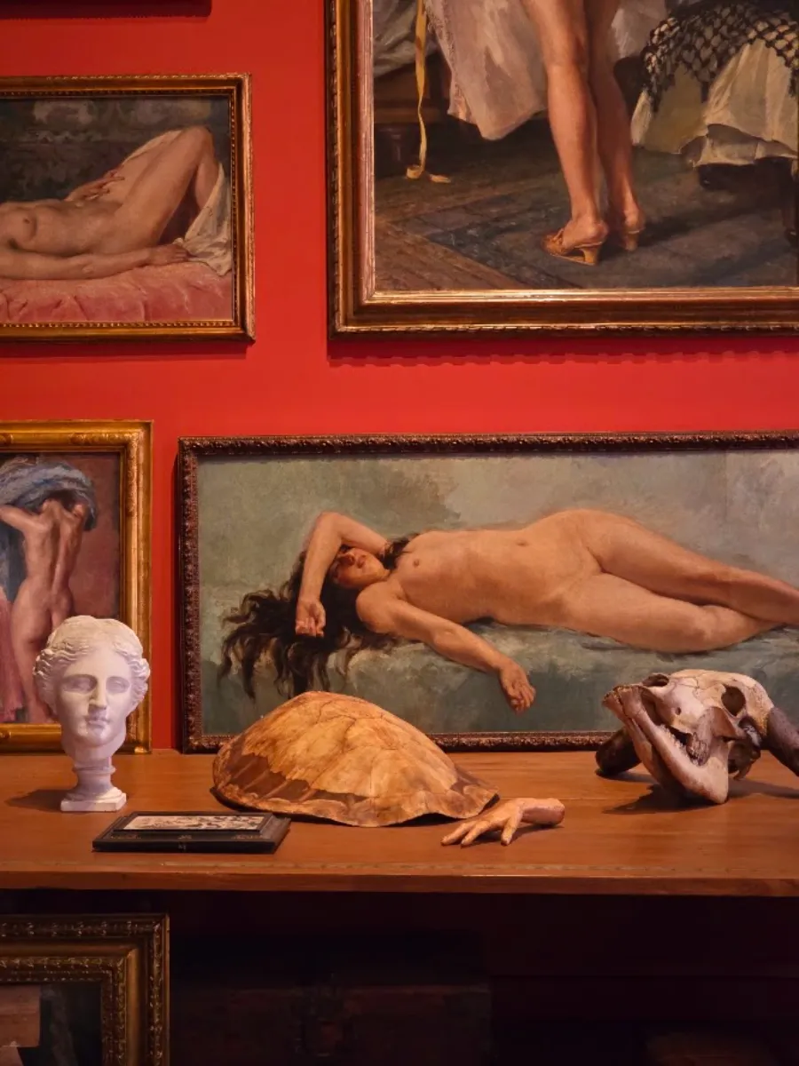 A red salon hung with paintings, Venice